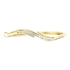 14 Karat Yellow Gold Channel Set Diamond Wave Bangle Bracelet