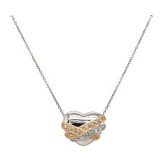 0.25ctw Diamond Two Tone Heart Pendant Necklace in Platinum and 18K Yellow Gold