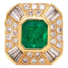 Anello con smeraldo e diamante in oro giallo