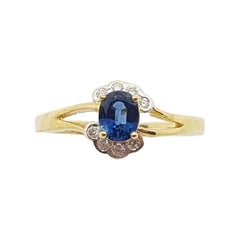 Bague en or 18 carats sertie d'un saphir bleu et de diamants