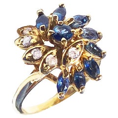 Anello cocktail con zaffiro blu e diamante in oro giallo 14 carati .65 TCW