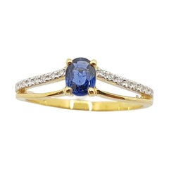 Bague en or 18 carats avec saphir bleu et diamant