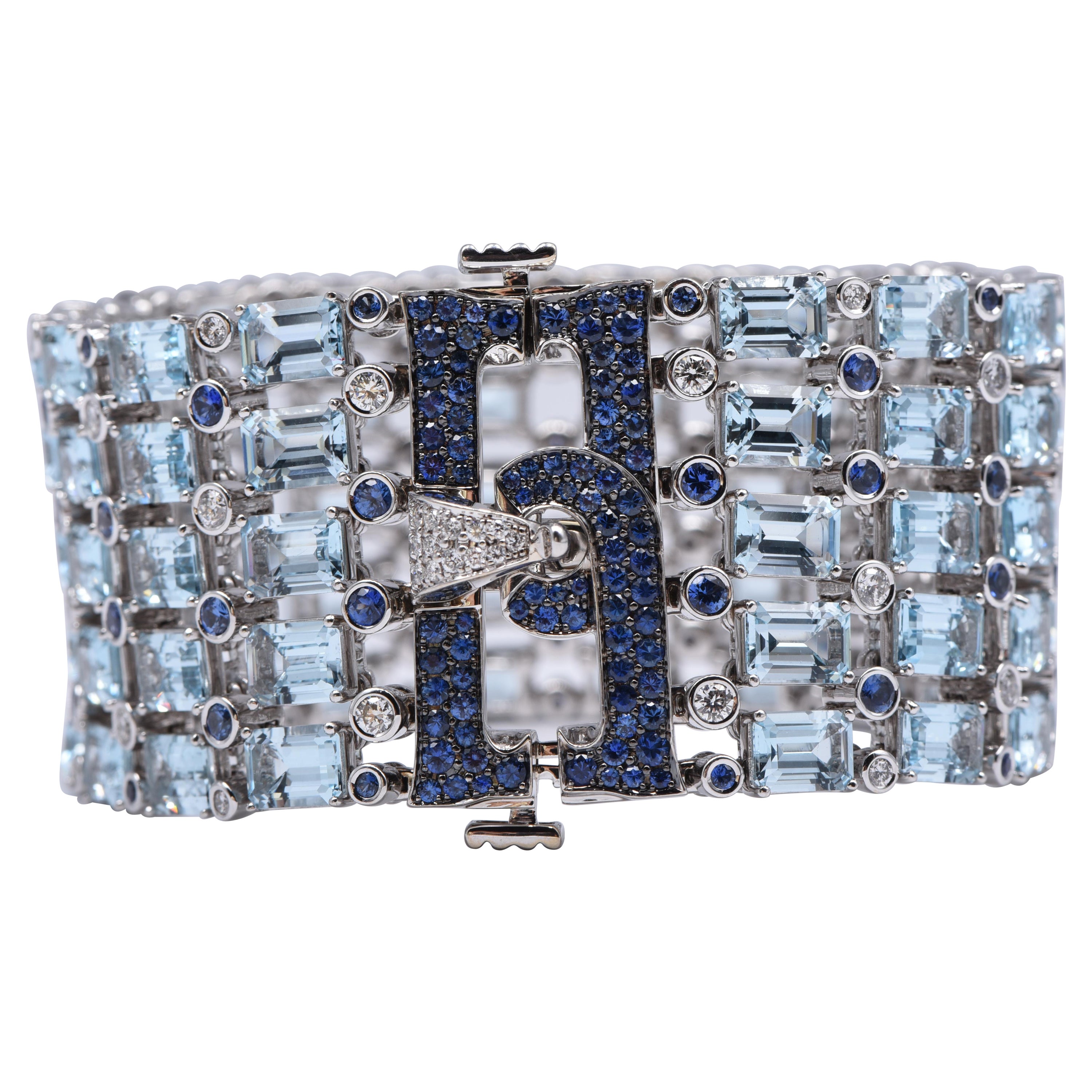 Bracelet en or blanc 18 carats avec diamants blancs, saphirs bleus et topaze bleue