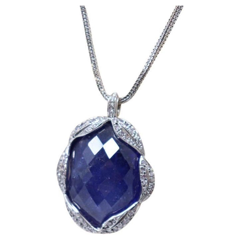 65 Ct Tanzanite and Diamond Pendant Necklace in 18 Kt White Gold For Sale