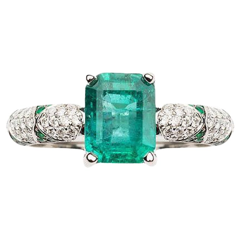 Lotus Emerald Solitaire Center with Emerald Petals and Pave Diamond Ring