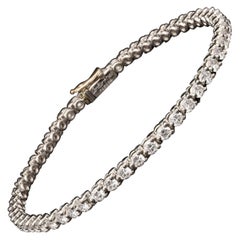 Bracelet classique Cartier en platine et diamants ronds brillants - années 1960