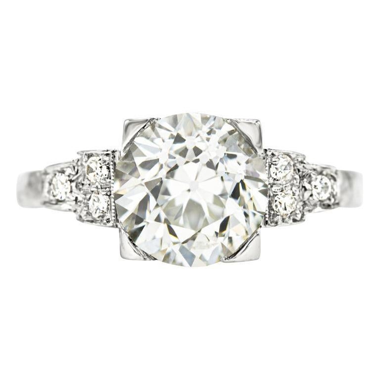 Broad and beautiful. What more could you ask for? A 2.31 ct. old European cut diamond centers this antique engagement ring, sparkling with every subtle movement. The setting is so classically deco, with its graduated diamond-studded shoulders and