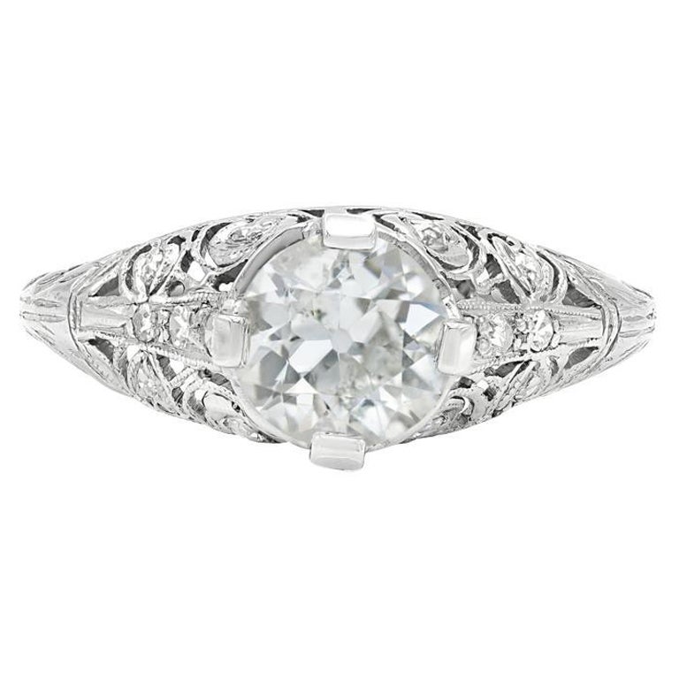 An Edwardian engagement ring with all the distinguishing features from the era we so love. The center old European cut is sun catching and has the most beautifully lively facets. Hand crafted filigree along the setting adds so much charm. Bright,