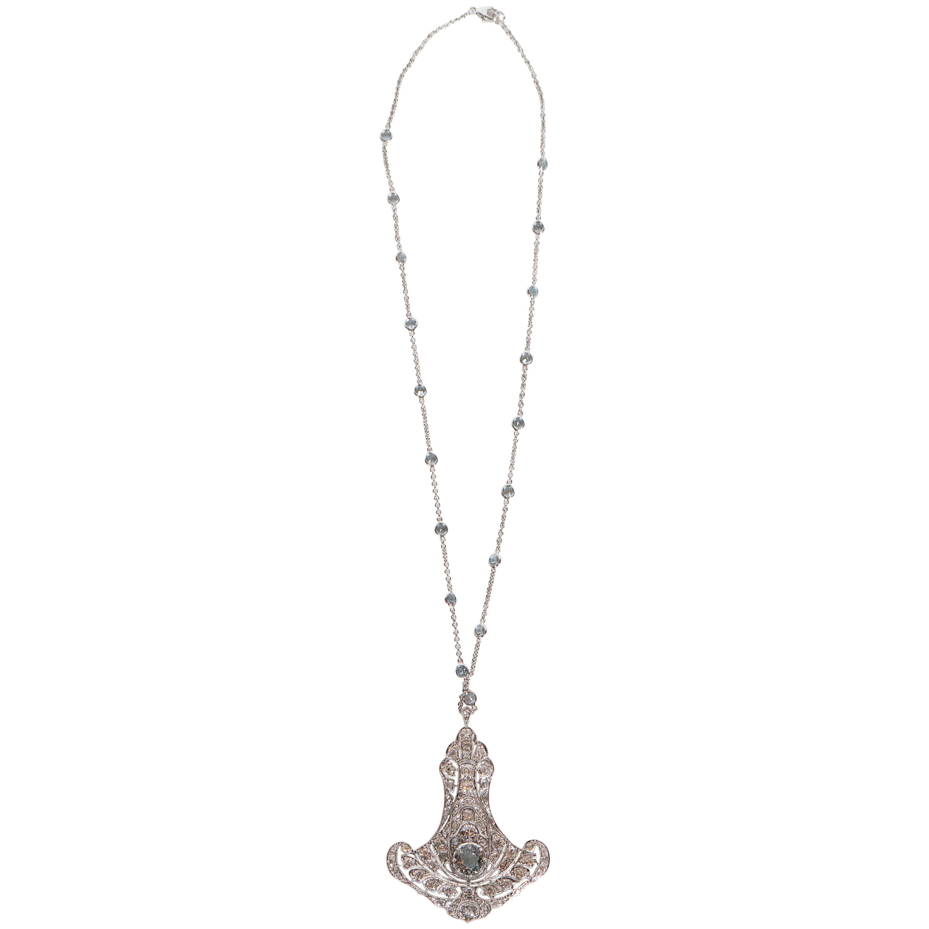 This stunning pendant is set with a round aquamarine of exceptional quality and the white gold chain is set with 18 aquamarines of same fine quality.The platinum pendant is set with approximately 2 carats of full cut diamonds.A great example of the