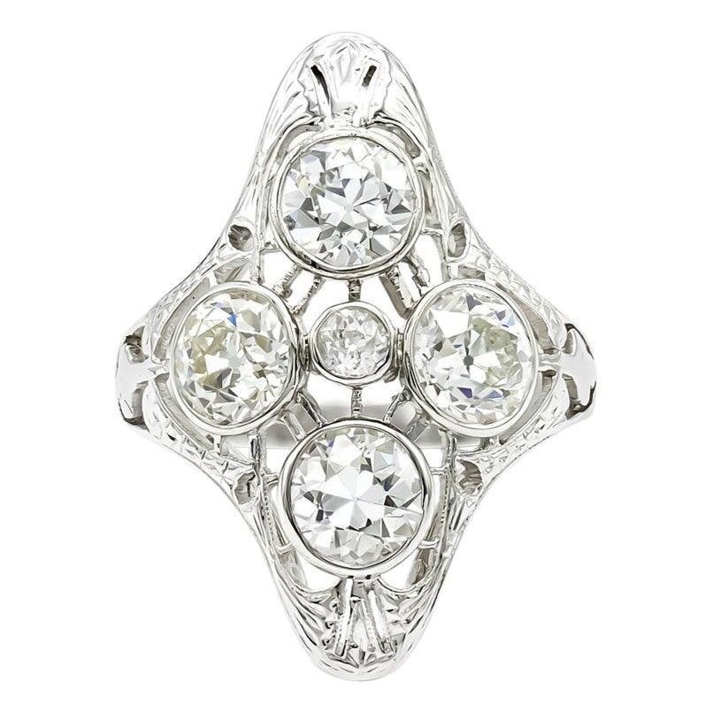 What a quartet! This platinum and diamond art deco ring is really superb, both for the quality of its workmanship and the old European diamonds it features. Almost 3 carats of diamonds in all, we love the four points design of this ring and its