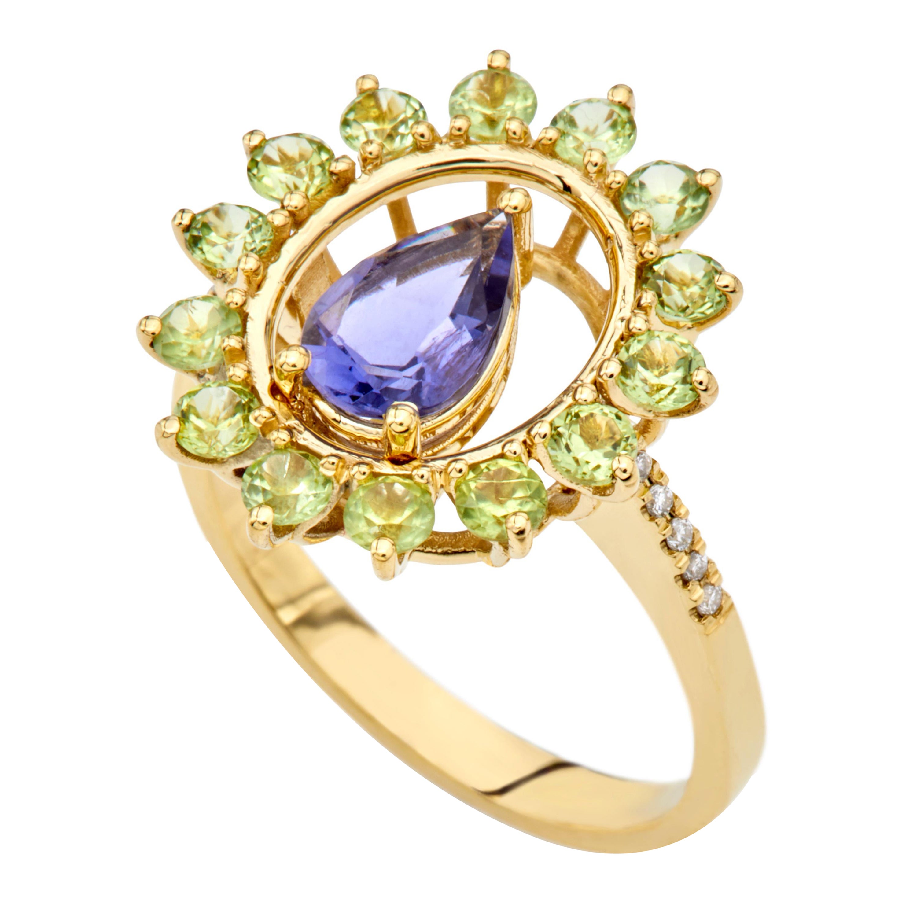 For Sale:  Ring in 18kt Yellow Gold Pear Iolite Peridots and Diamonds Oval Shape Cluster