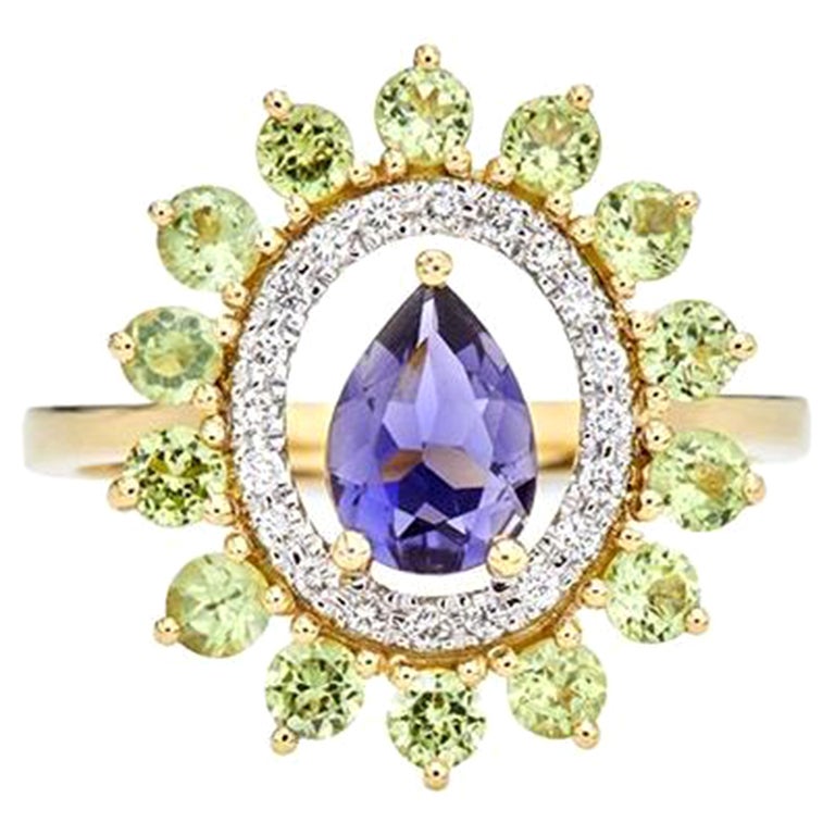 For Sale:  Ring in 18kt Yellow Gold Pear Iolite Peridons and Diamonds Oval Shape Cluster