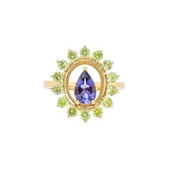 Ring in 18kt Yellow Gold  Pear Iolite Center and Round Cluster Peridot  Kallisto