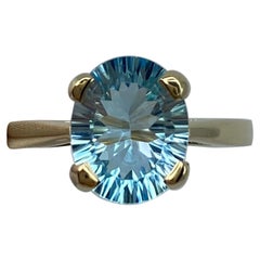2.80 Carat Swiss Blue Topaz Fancy Oval Concave Cut Yellow Gold Solitaire Ring