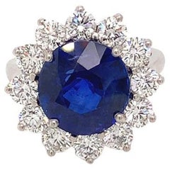 6.10 Carat Round Brilliant Sapphire and Diamond Cluster Ring in Platinum