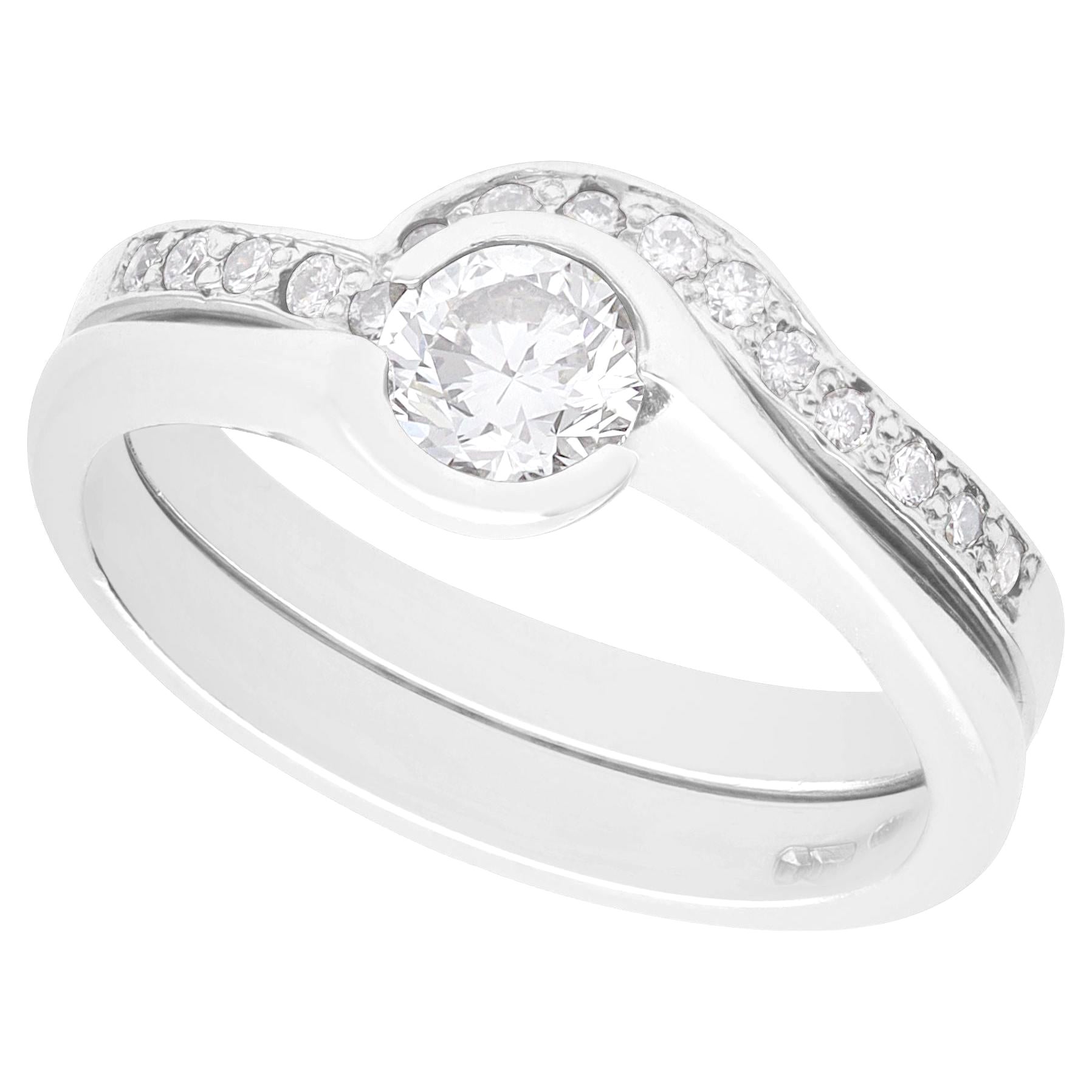 Contemporary GIA Certified 0.65 carat Diamond and Platinum Ring and Wedding Band For Sale