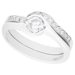 Contemporary GIA Certified 0.65 carat Diamond and Platinum Ring and Wedding Band