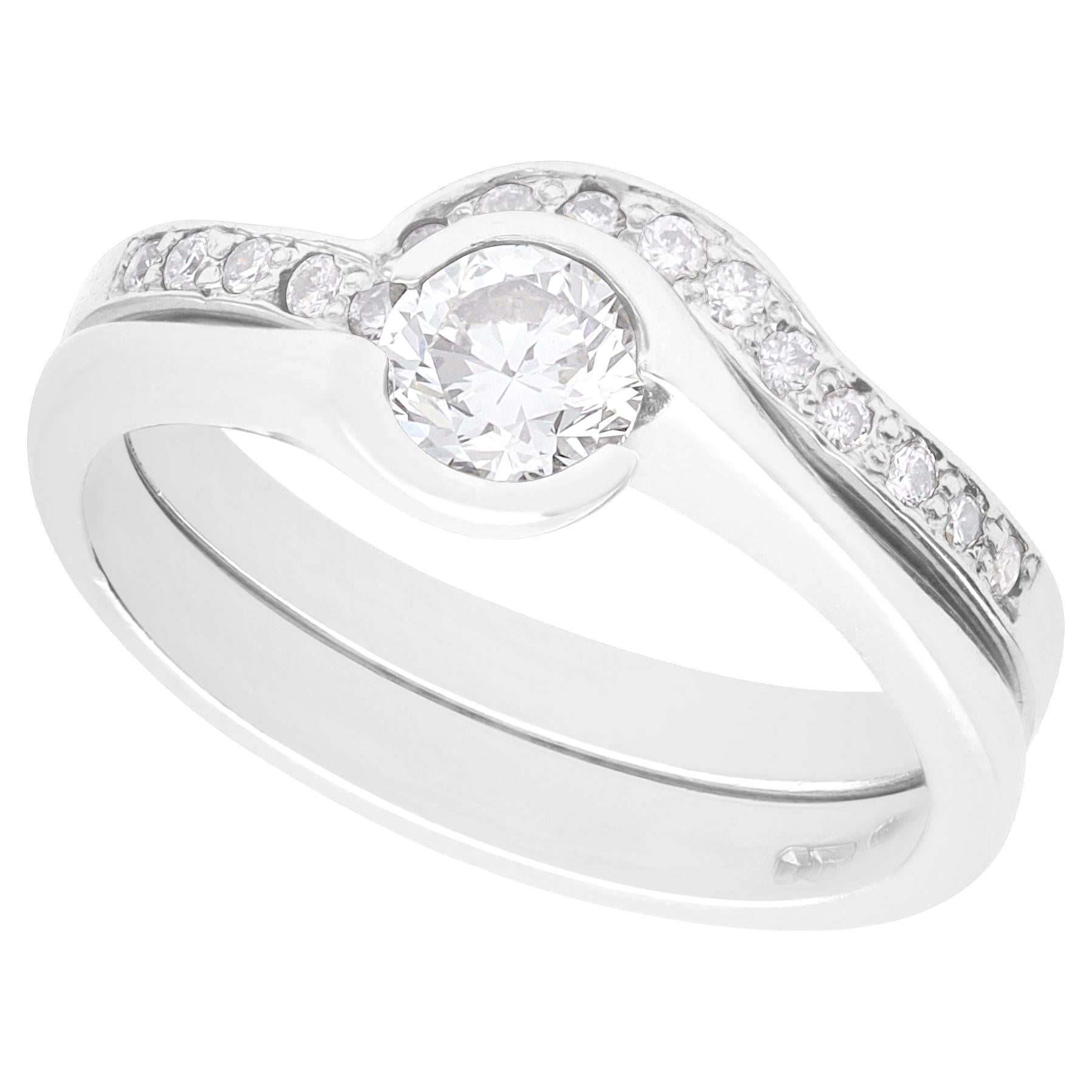 Anello di fidanzamento e fede in platino e diamanti certificati GIA da 0,65 carati