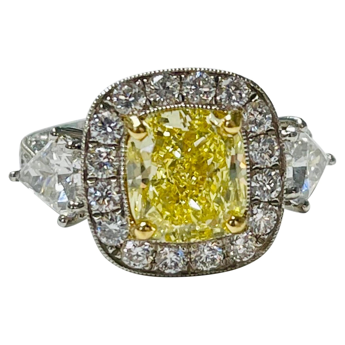 Verlobungsring, GIA-zertifizierter intensiv gelber Fancy-Diamant im Kissenschliff und weißer Diamant