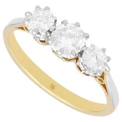 Anello di fidanzamento vintage con diamante e oro giallo incastonato in platino a trilogia
