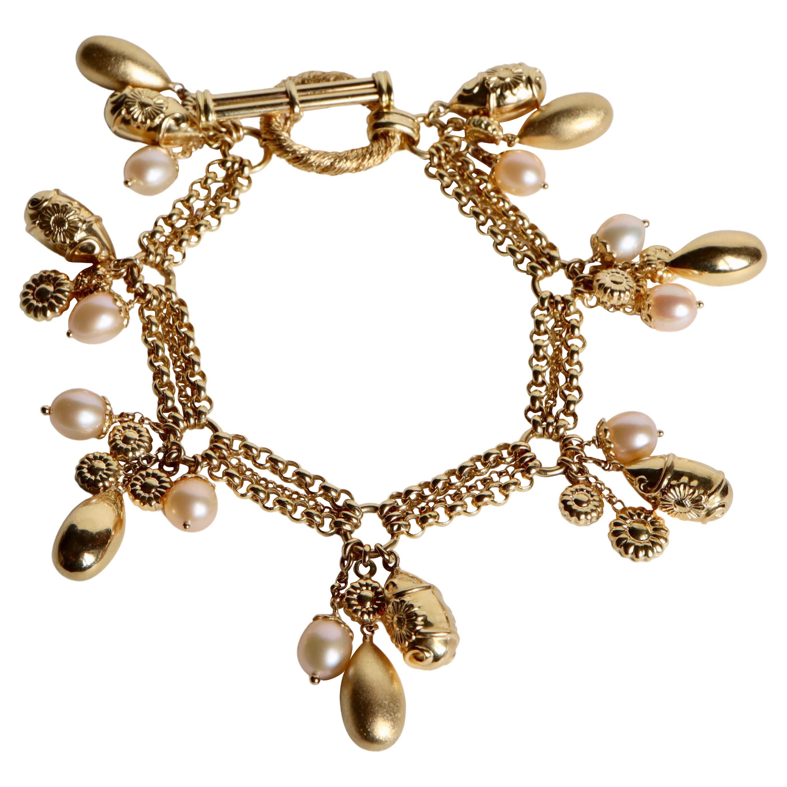 Charm Bracelet in 18k Yellow Gold and Pearls For Sale
