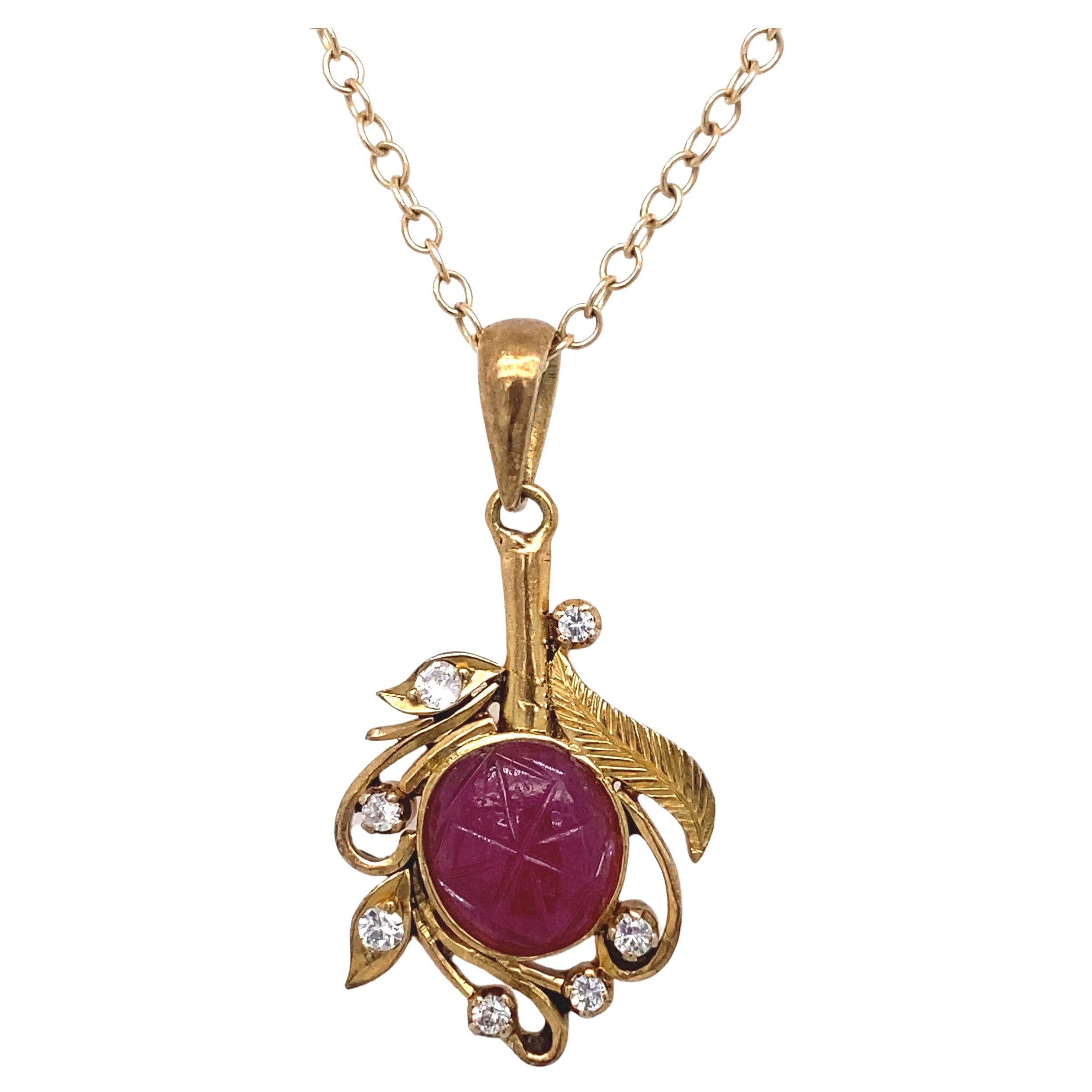 1940s Carved Ruby and Diamond Pendant in 14 Karat Gold