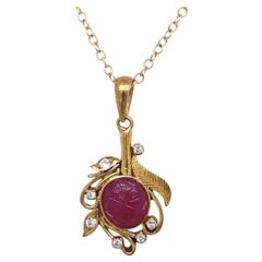 Vintage 1940s Carved Ruby and Diamond Pendant in 14 Karat Gold