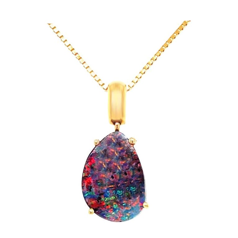 The 'Milkyway Untold' pendant features a sublime and breathtaking boulder opal (4.46ct) from our Jundah-Opalville mines in Queensland presenting a luminous colour play decorated by vibrant specks of red and blue. Masterfully set in 18K yellow gold,