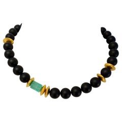 Black Onyx Beads with Emerald Crystal '14 ct.' and 18 Carat Yellow Gold Mat
