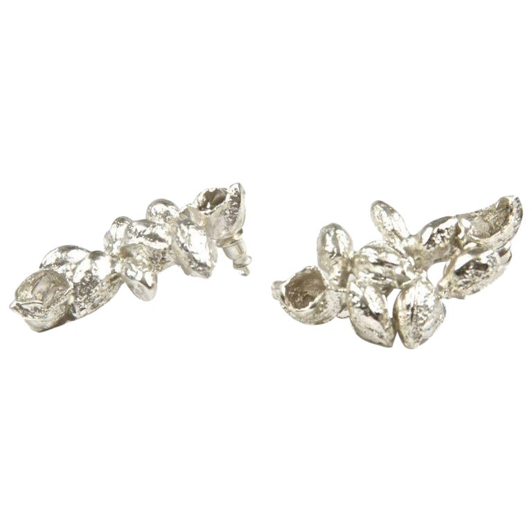 Karpoi Earrings in Silver For Sale