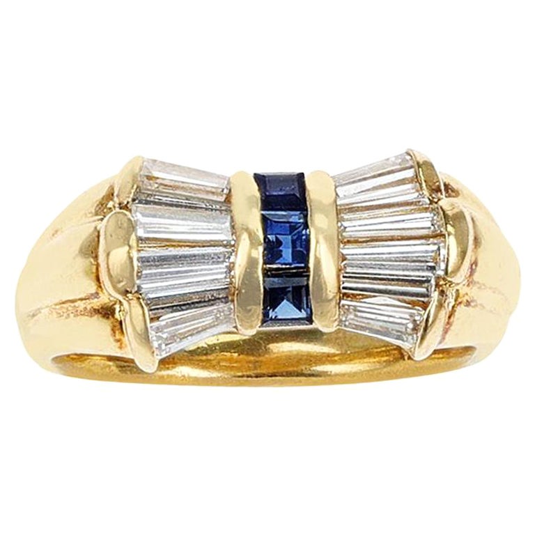 0.81 Ct. Diamond Baguettes and 0.28 Cts. Square Cut Blue Sapphire Bow Ring, 18K For Sale