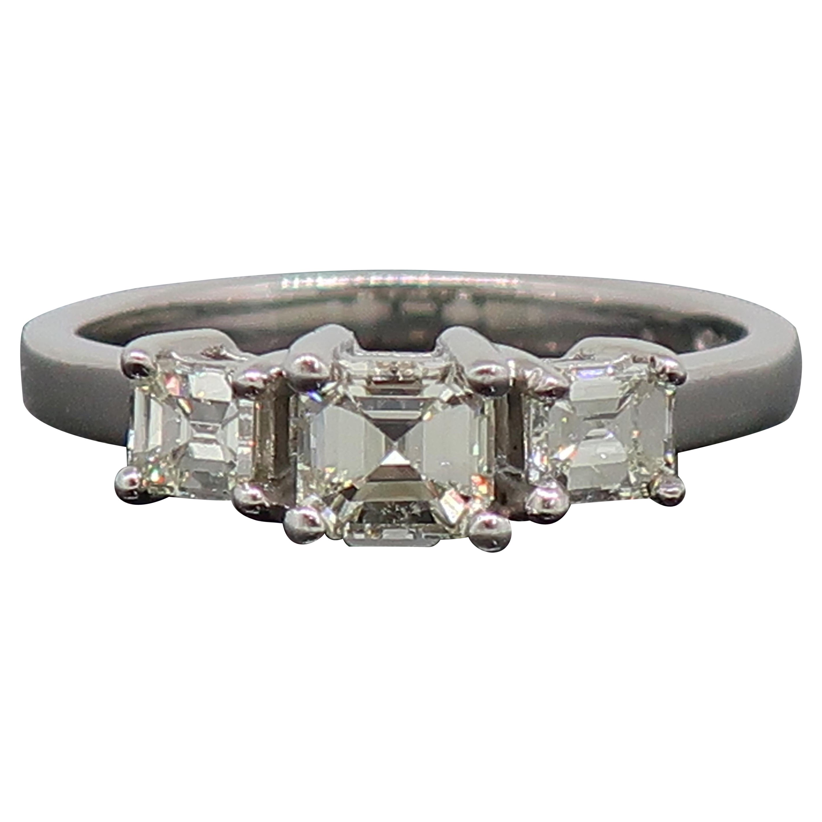 Emerald Cut Diamond Three-Stone Ring 18 Karat White Gold 0.76ct For Sale