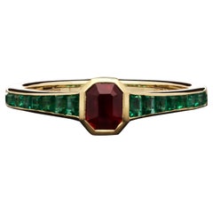 Hancocks 0.46ct Burmese Ruby Ring with Emerald Shoulders in 18ct Yellow Gold