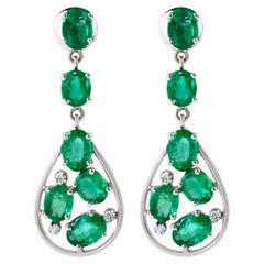 18 Karat White Gold 6.52 Carat Oval-Cut Emerald and Diamond Dangle Earrings