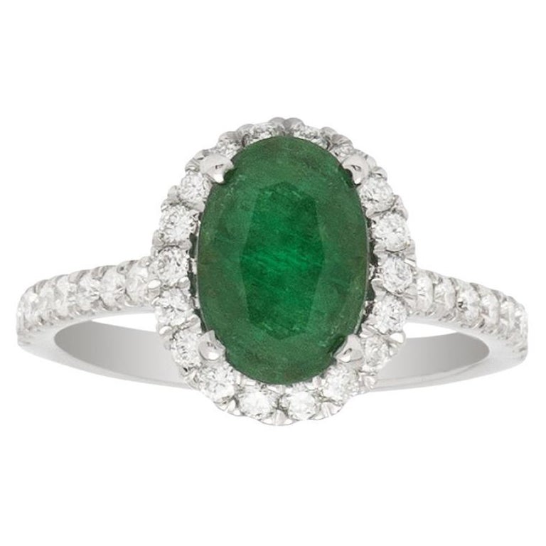 1.77ct Emerald Halo Ring in 14K White Gold; 0.50ct Side Diamonds