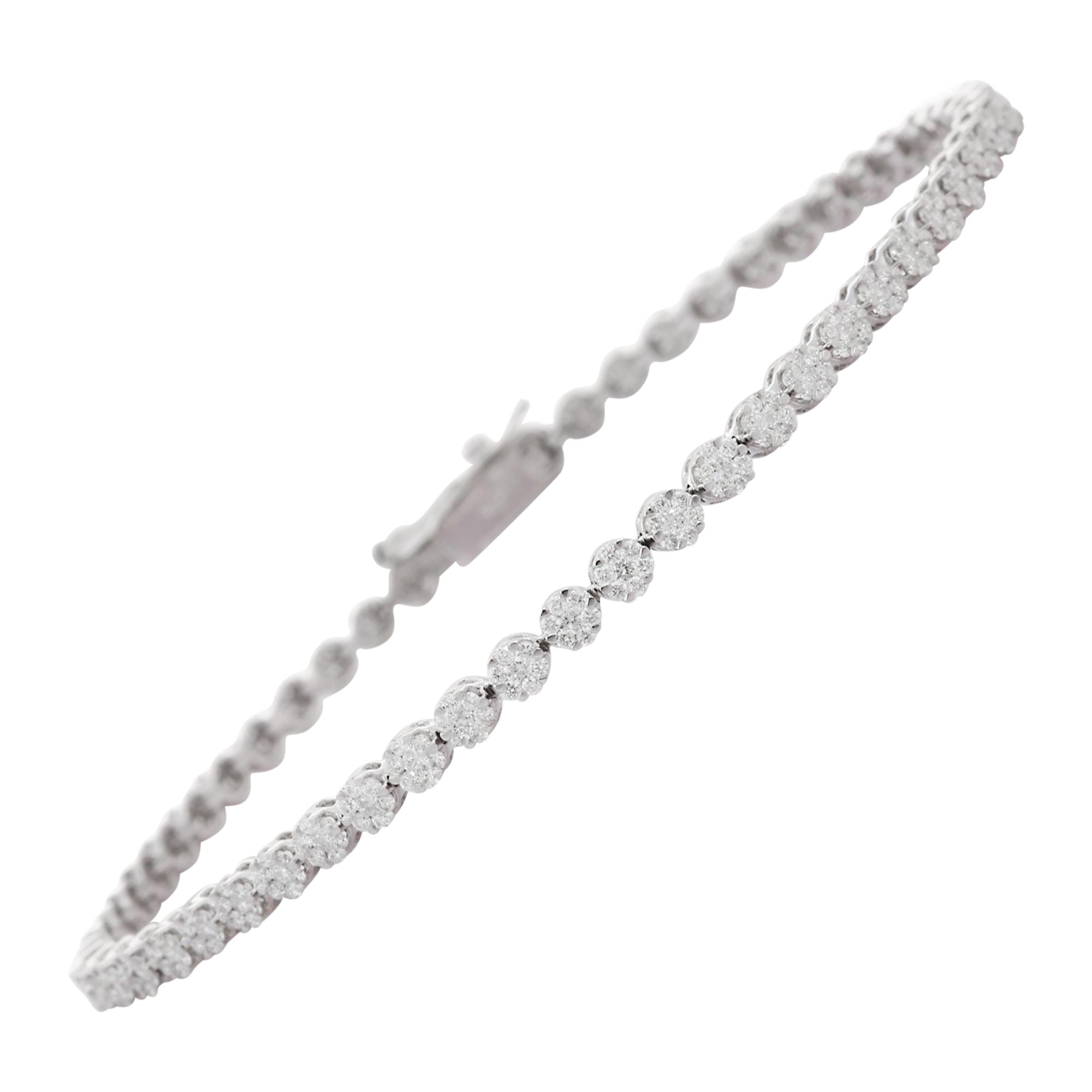 This Dainty Diamond Cluster Tennis Bracelet in 18K gold showcases sparkling natural diamonds, weighing 2.01 carats. 
April birthstone diamond brings love, fame, success and prosperity.
Designed with diamonds cluster set in continuation to make you