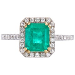 Ring in 18Kt White Gold with 1.70ct Rare Green Emerald Cut Emerald and Diamonds 