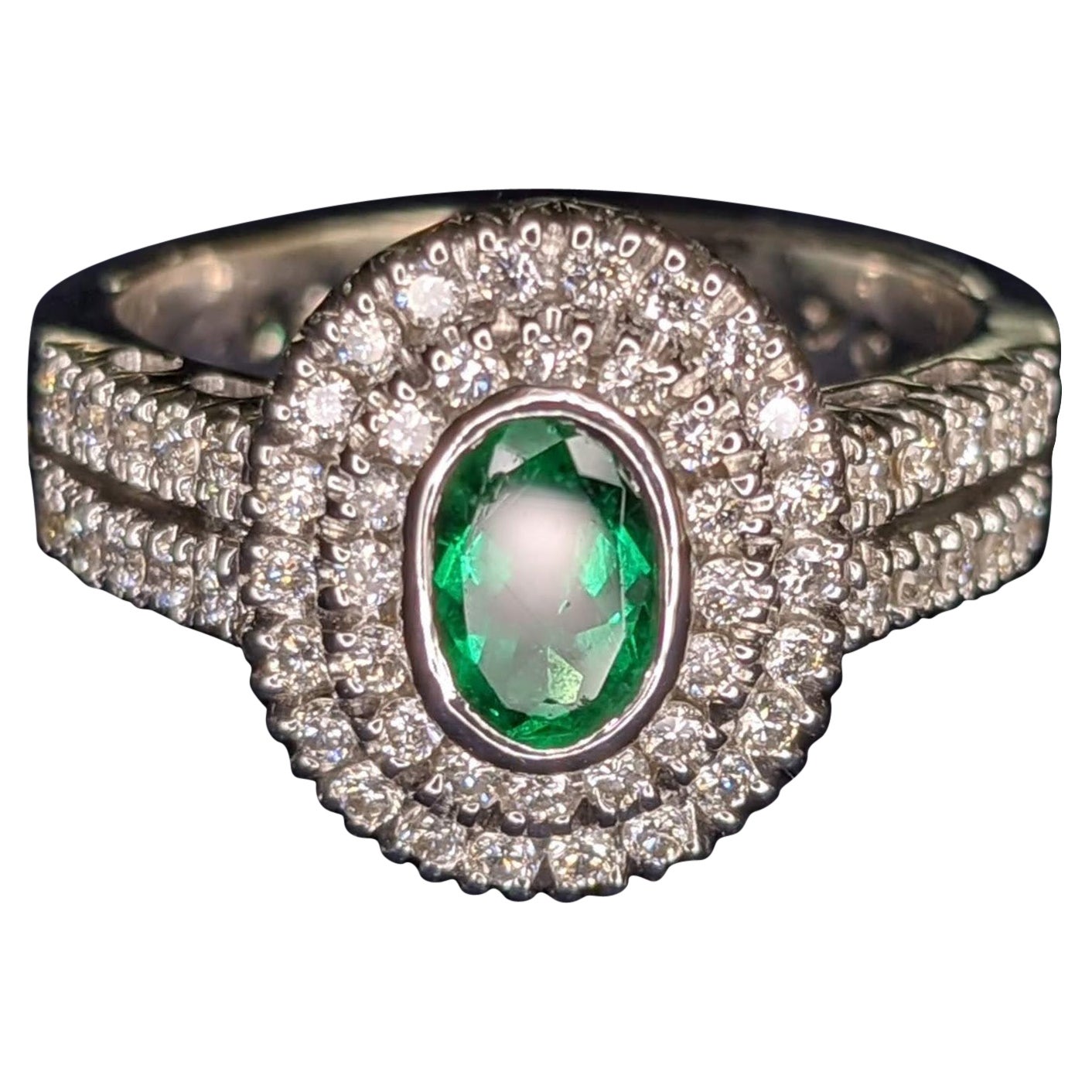 0.44 Carat Natural Oval Emerald 0.48 Carat White Diamonds 18 Karat Gold Ring