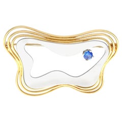 Broche vintage de style Art nouveau en or mélangé avec saphir bleu