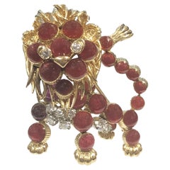 Cartier France 1960s Yellow Gold Diamond and Red Cabochon Stone Lion Brooch