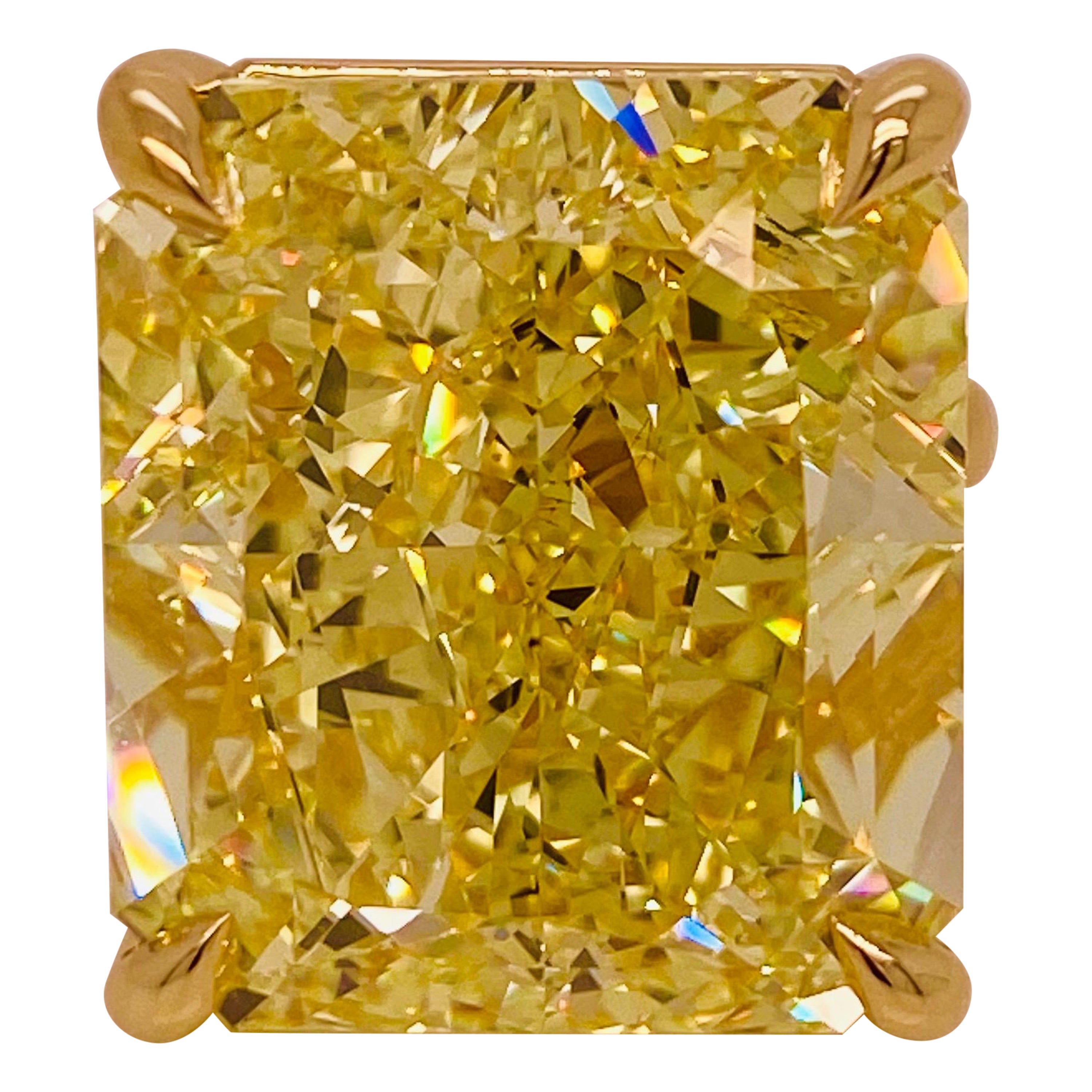 From the Emilio Jewelry Museum Vault,
A one of a kind 41.00ct + Fancy Intense Radiant Yellow Diamond, of mind blowing color, and fire! We created a simple mounting to be worn everyday. Can be redesigned by our team.