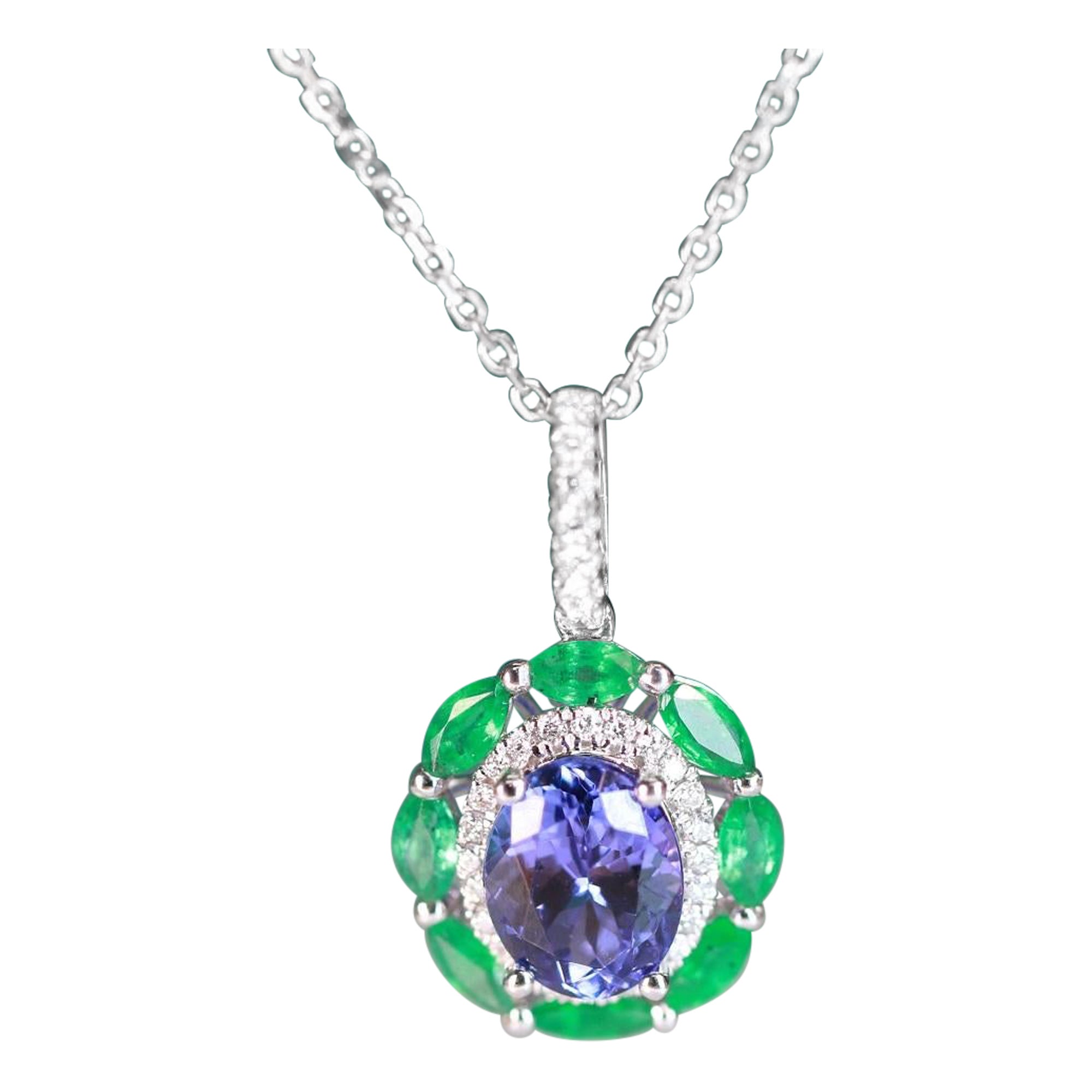 1.69 Carat Oval Tanzanite Round Emerald and Round Diamond 14K White Gold Pendant For Sale