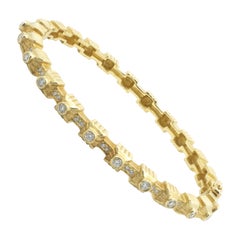 Bracelet bangle Doris Panos en or jaune 18 carats et diamants