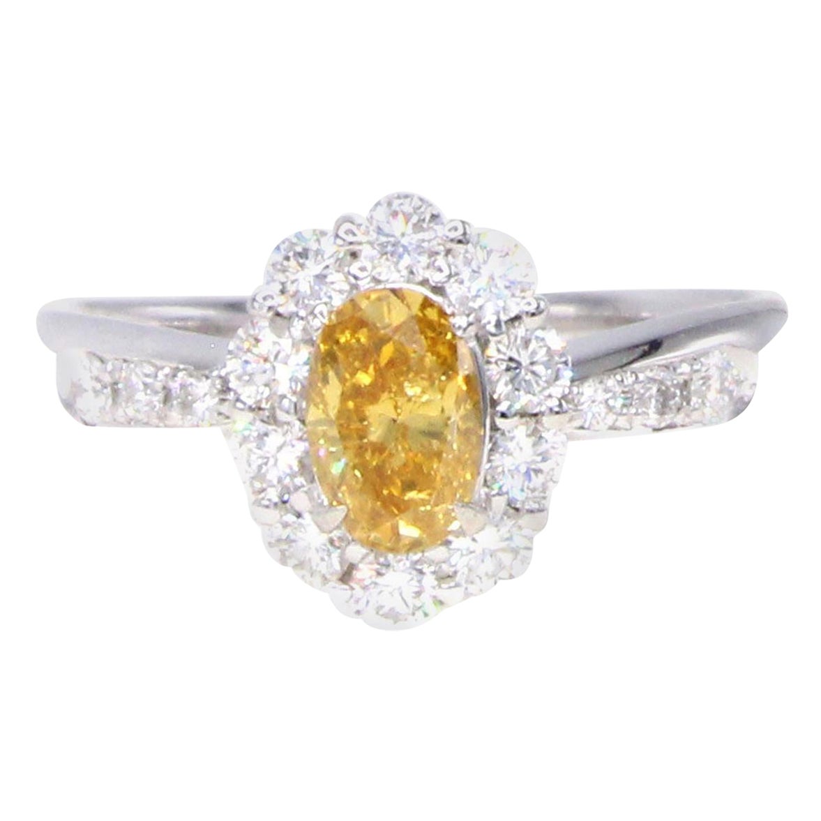 Vivid Yellow-Orange Oval Diamond and White Diamond Platinum Ring