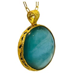 Celeste Reversible Aqua and Mother of Pearl Pendant in 22k Gold, by Tagili