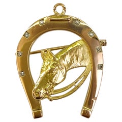 18 Karat Gold and Diamond Horseshoe Brooch