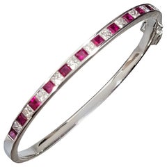 Princess Cut Ruby and Diamond Oval Hinged Bangle Bracelet in 18 Karat White Gold