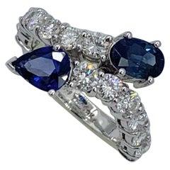 1.4 CT Royal Blue Sapphire 1.4 CT Diamond Snake Crossover Ring 18 Karat Gold