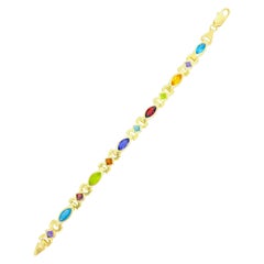 Bracelet vintage en or 14 carats avec pierres précieuses multicolores de formes mélangées