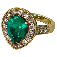 GIA Certified 3.25 Carat Colombian Emerald and Diamond Engagement Ring.